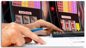 Hands Using Calculator, Taking Notes, Slot Machines Background