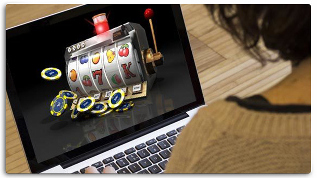 Woman on Laptop Playing Online Casino Game