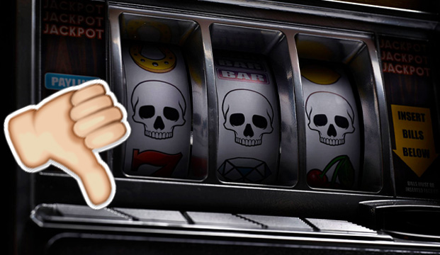 Slot Machine Displaying Three Skulls, Thumbs Down