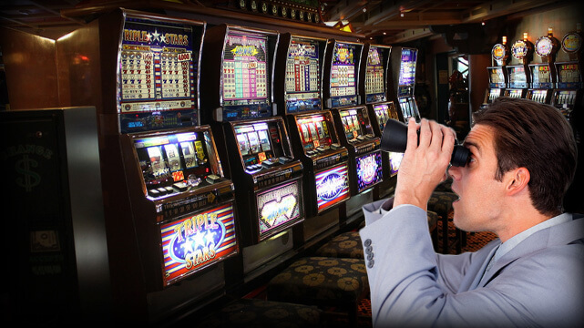 Guy Looking Through Binoculars at a Row of Casino Slot Machines
