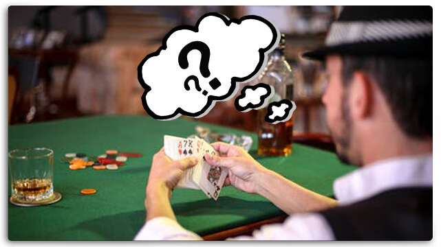 Guy Sitting at Poker Table, Holding Cards, Though Bubble with Question Marks
