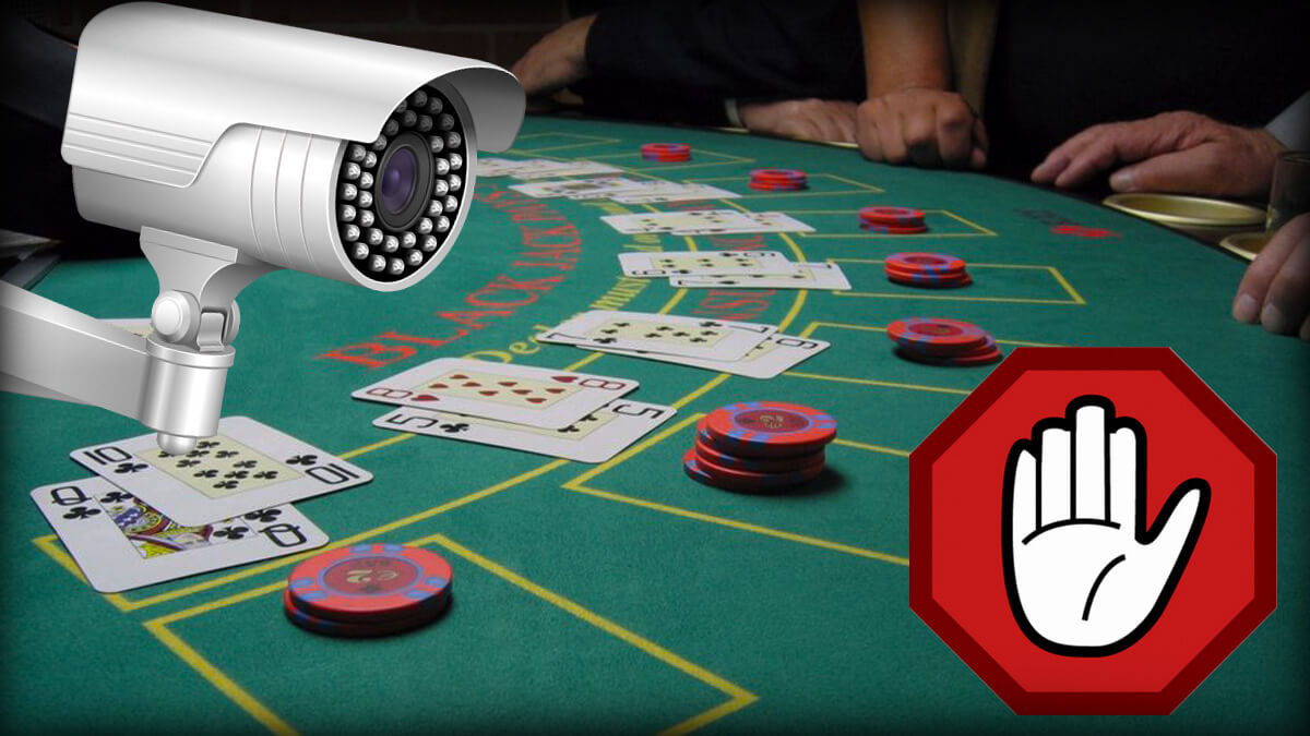 People Playing Casino Blackjack, Hand on Red Caution Icon, Security Camera Over Blackjack Table