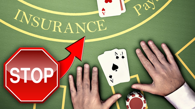 Hands on Blackjack Table, Red Arrow and Stop Sign Pointing to Insurance on Blackjack