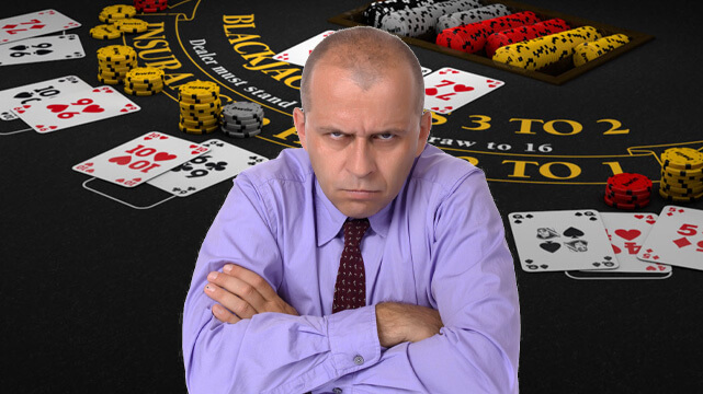 Blackjack Table with Cards and Casino Chips, Angry Man with Arms Crossed