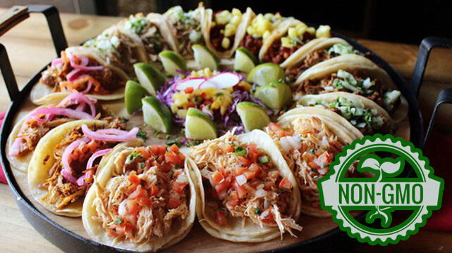 Plate of Tacos from El Dorado Cantina, Non GMO Logo