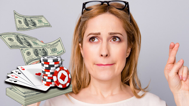 Woman Crossing Her Fingers, Money Pile with Poker Chips and Cards