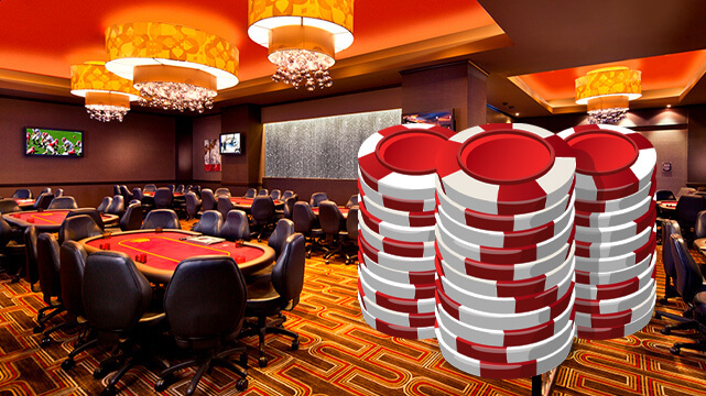 Poker Room with Red Casino Chips Stacked
