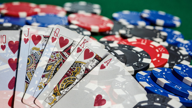Casino Chips on Table, Poker Cards Spread Out