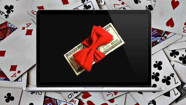 Poker Cards Piled Up, Computer with Stack of Money with a Ribbon