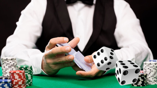 Casino Dealer Shuffling Cards, Casino Chips and Dice