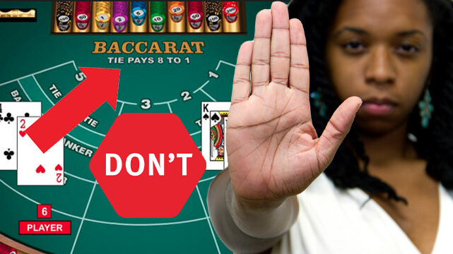 Baccarat Table, Red Arrow and Red Don't Stop Sign, Woman Holding Hand Up