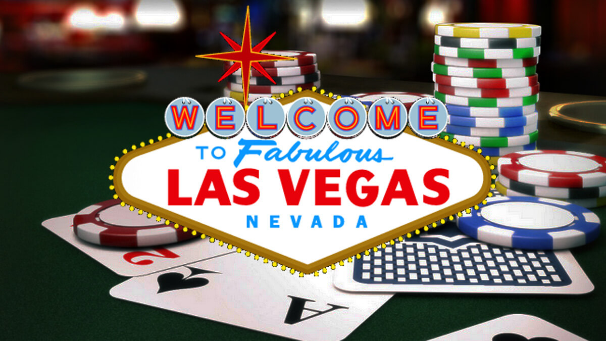Table with Poker Cards and Casino Chips, Welcome to Las Vegas Sign