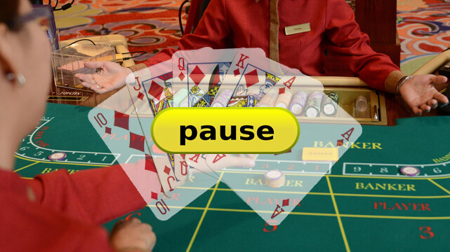 Casino Dealer and Player at Baccarat Table, Yellow Pause Button, Poker Cards