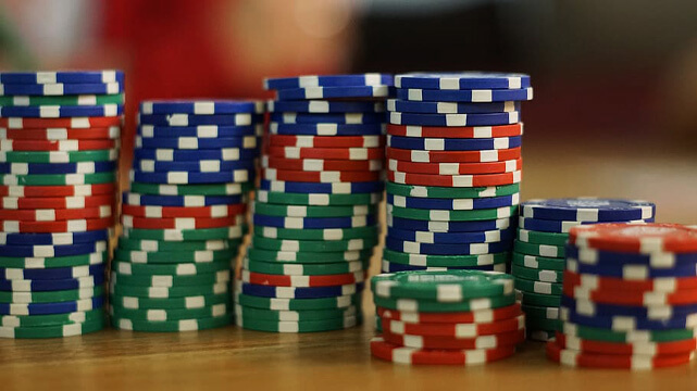 Stacks of Colored Casino Chips on Table