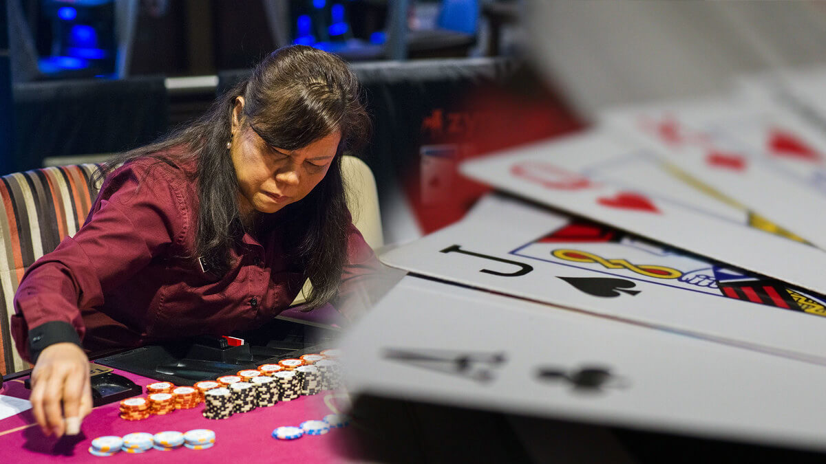 Casino Dealer Looking Over Casino Chips, Blackjack Cards Spread