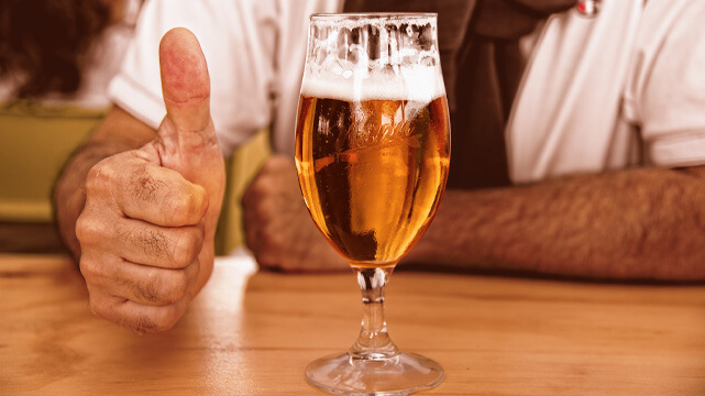Guy Sitting With Beer In Front of Him, Thumbs Up