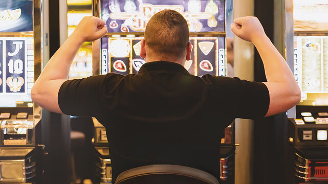 Slot Machine Player with Fists Up