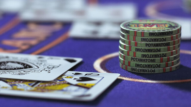 Blackjack Cards and Casino Chips on Casino Blackjack Table