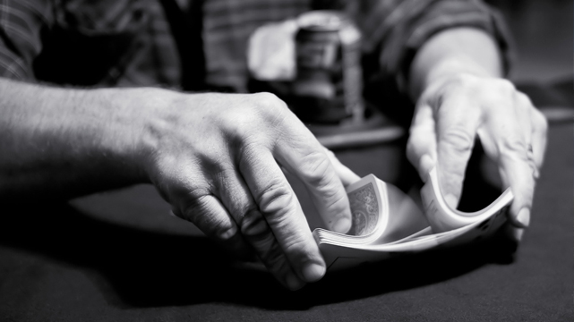 Closeup of Hands Shuffling Playing Cards