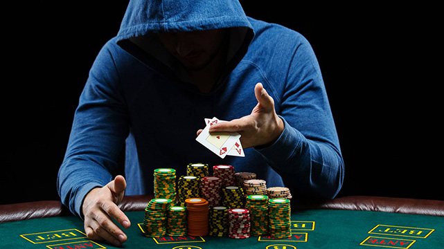 Poker Player With Aces and a Stack of Chips