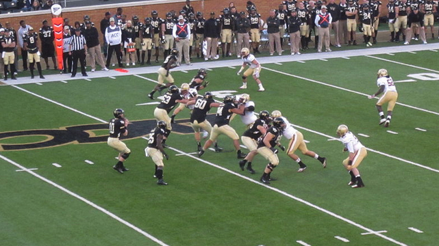 Two College Teams Running a Play