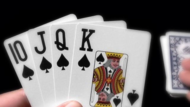 Closeup of a Ten, Jack, Queen, and King of Spades