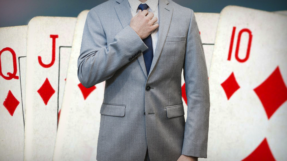 Man in Suit Adjusting Tie With Poker Card Background