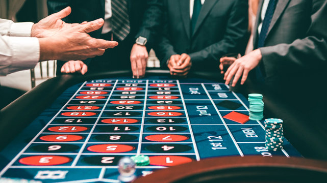 Men in Suits Playing Roulette