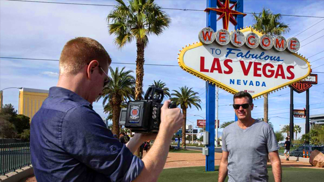 Man Being Filmed in Front of Welcome to Las Vegas Sign
