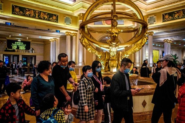 People Wearing Mask Inside of a Casino