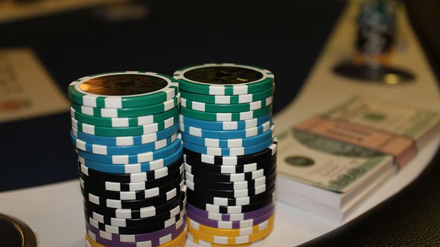 Poker Chips and Cash on a Home Poker Table