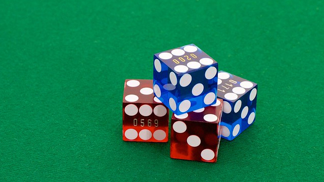 Red and Blue Dice on a Casino Table
