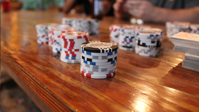 Poker Chips on a Wooden Table