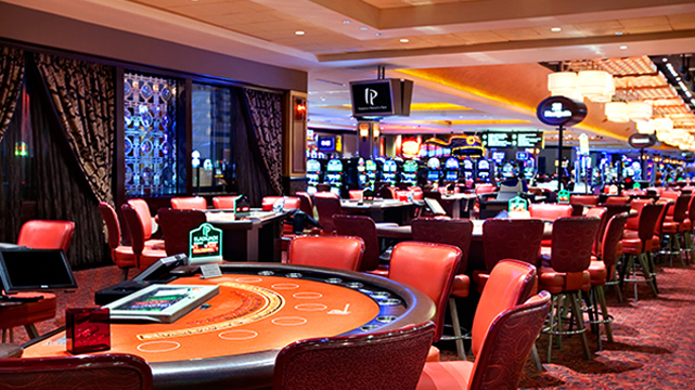 View of a Casino Floor With Table Games and Slots