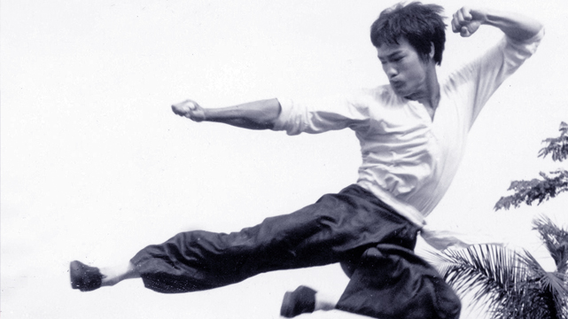 Bruce Lee Performing a Jump Kick