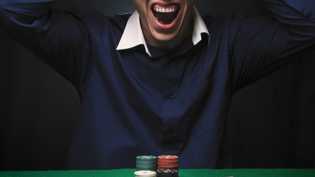 Man Screaming at a Casino Table