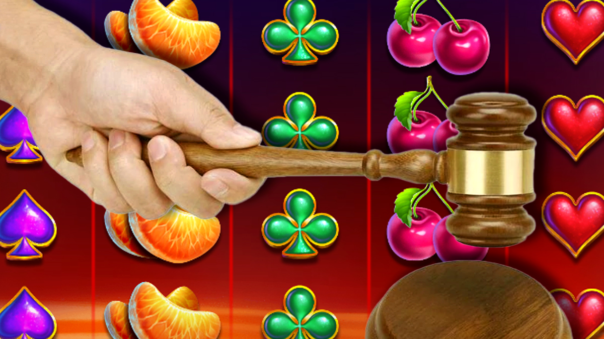 Hand Using a Gavel With a Slots Background
