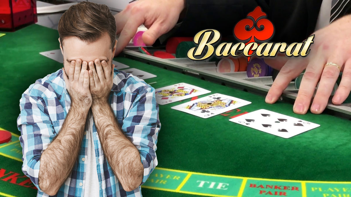 Man With Head In Hands in Front of Baccarat Table