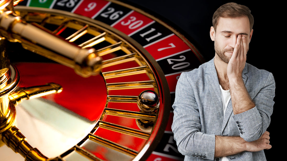 Man in Disappointment in Front of Roulette Table