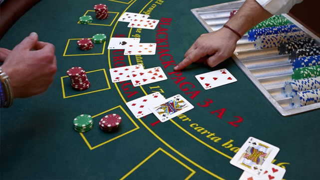Several blackjack hands on a table
