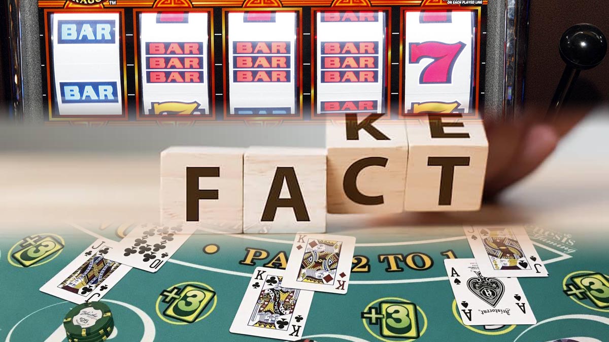 Blocks Spelling Fact or Fake With A Slots Rell Above And A Dealt Blackjack Hand on Table Below