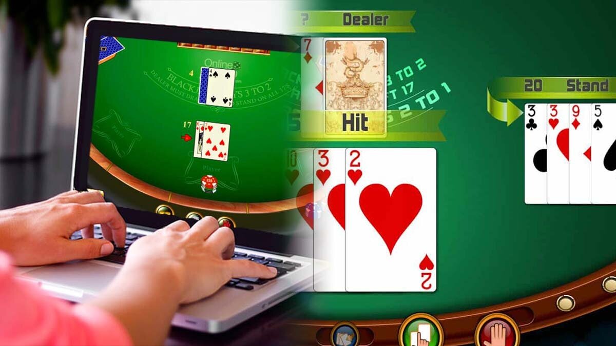 Person Playing Blackjack on a Laptop With An Online Blackjack Game On Right