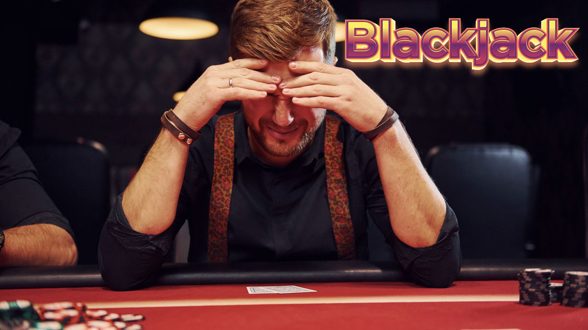 Man With Head In Hands at a Blackjack Table