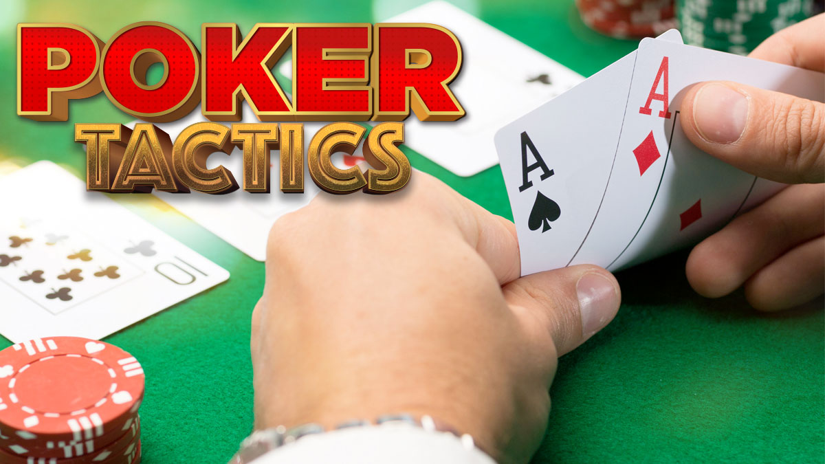 Hands Looking at Poker Cards With CHips and More Cards on the Table