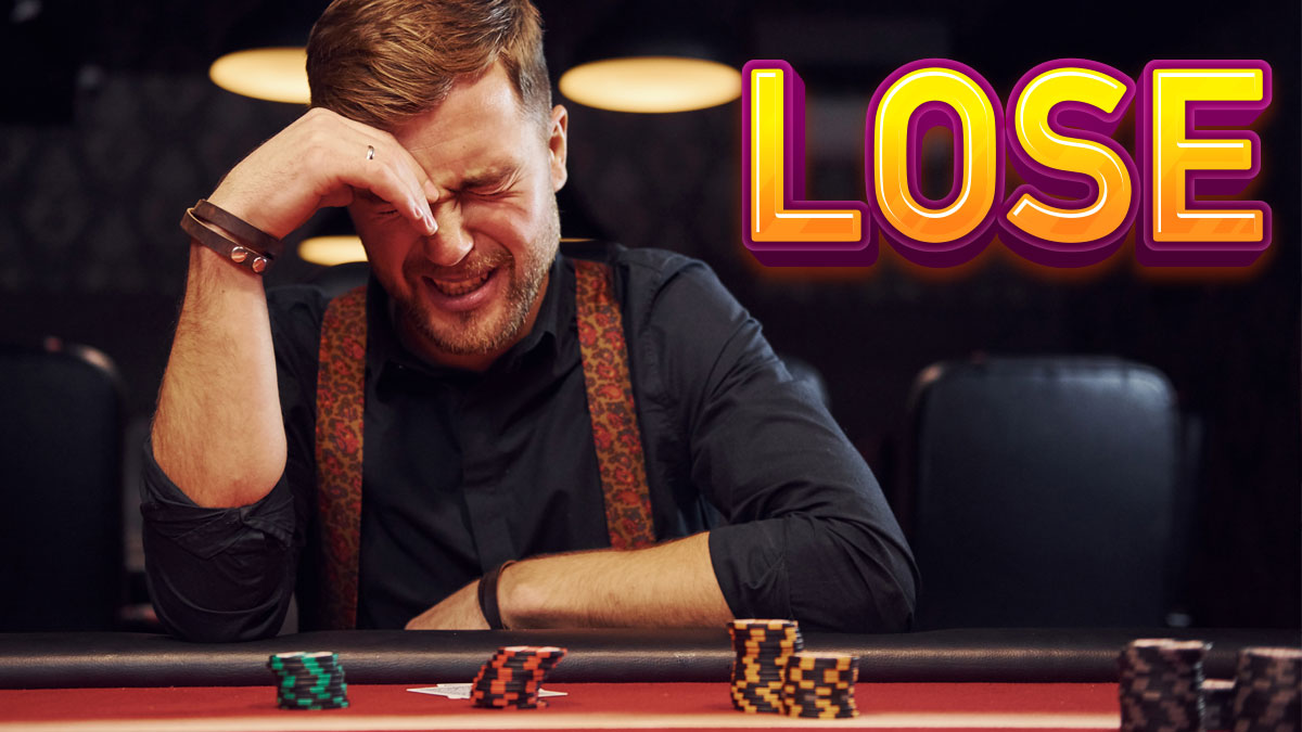 Gambler Cringing With his Hand to his Head at a Casino Table