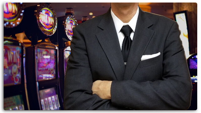 Casino Slot Machines, Man Wearing Suit, Arms Folded