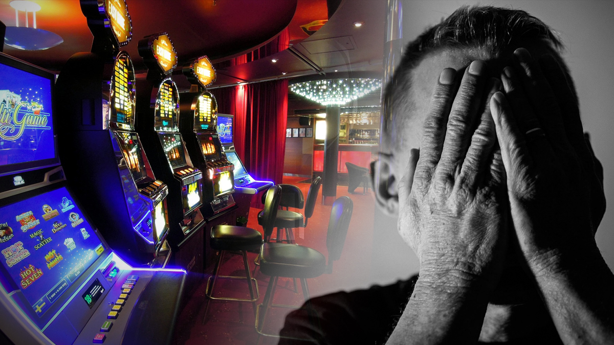Row of Slot Machines and Man Holding Hands Over Face
