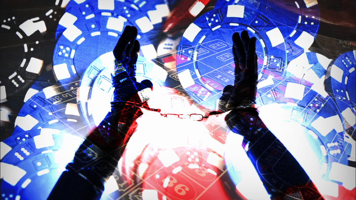 Handcuffed Hands พร้อมชิปคาสิโนและพื้นหลังรูเล็ต