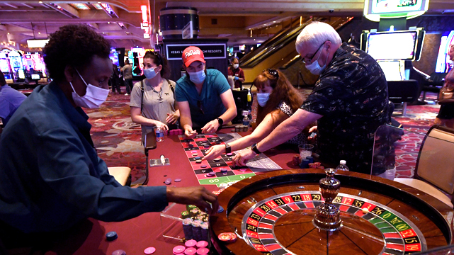 People playing roulette with masks on