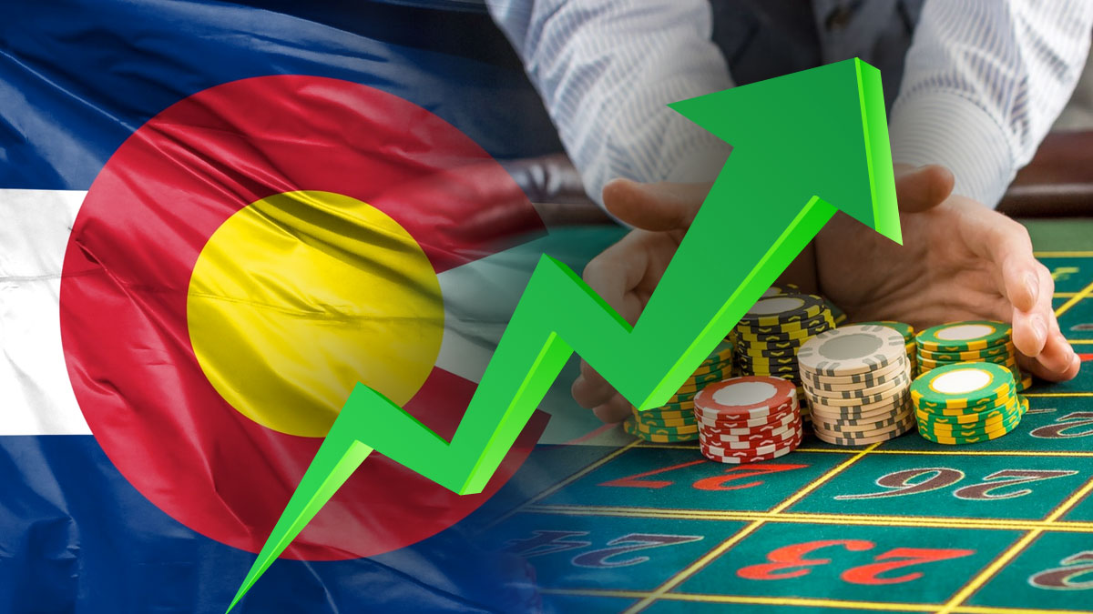 Colorado Flag with Green Chart Arrow Going up and Dealer Pushing Chips on a Table